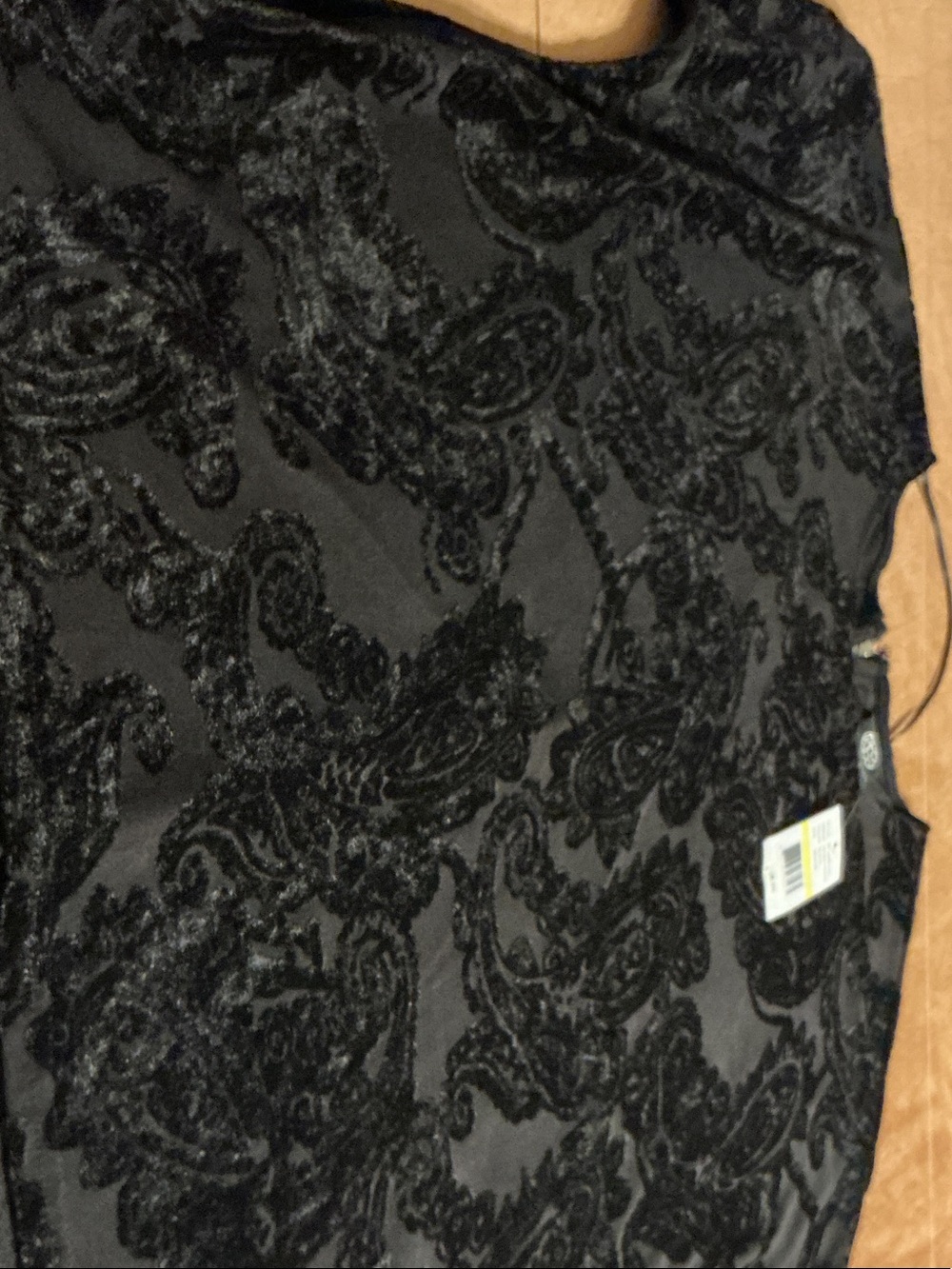 Black inlaid paisley over knit top.